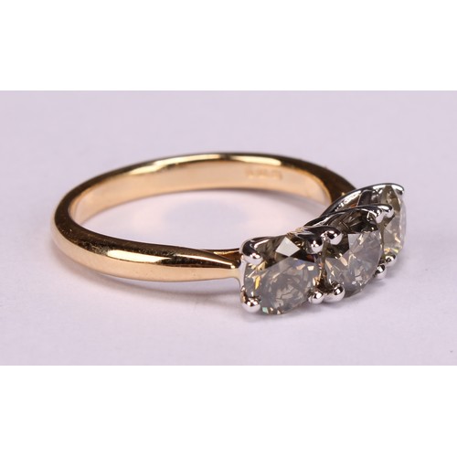 279 - An 18ct white and yellow gold three stone diamond ring, round brilliant cut diamonds 1.86ct. WGI Cer... 