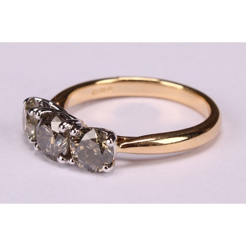 279 - An 18ct white and yellow gold three stone diamond ring, round brilliant cut diamonds 1.86ct. WGI Cer... 