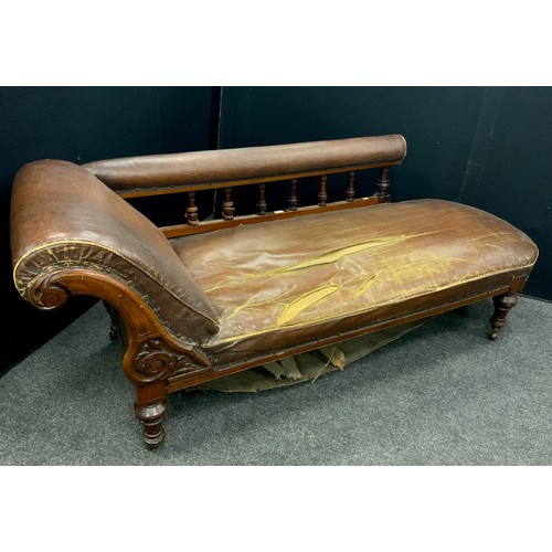 210 - A Victorian brown leather scroll end chaise longue, 72.5cm high x 192cm long x 69cm wide.