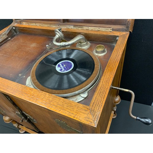 150A - A Meritone gramophone, with floor-standing oak cabinet, 87.5cm high x 78.5cm wide x 49cm deep, c.193... 