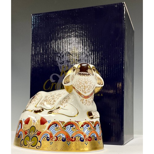 28 - A Royal Crown Derby paperweight, Water Buffalo, gold stopper, marks to base, 12cm high, boxed