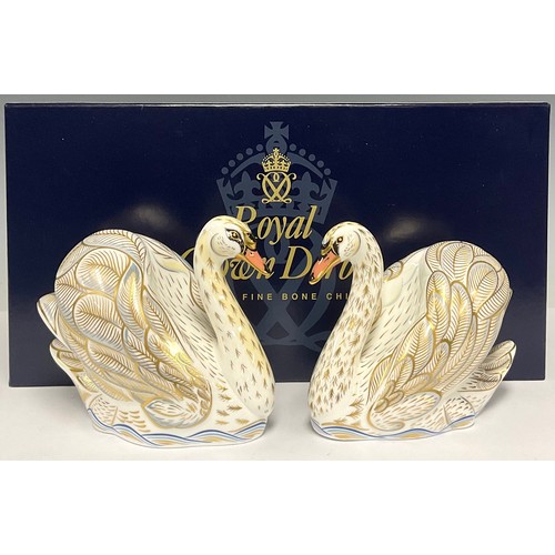 39 - A pair of Royal Crown Derby paperweights, The Royal Swans, William and Catherine, exclusive to Govie... 