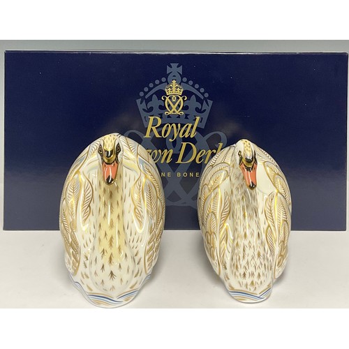 39 - A pair of Royal Crown Derby paperweights, The Royal Swans, William and Catherine, exclusive to Govie... 