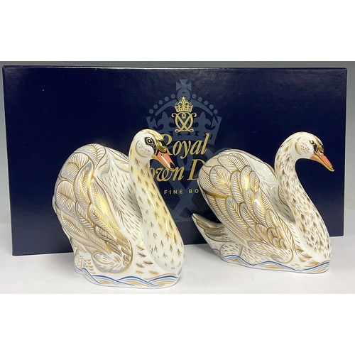 39 - A pair of Royal Crown Derby paperweights, The Royal Swans, William and Catherine, exclusive to Govie... 