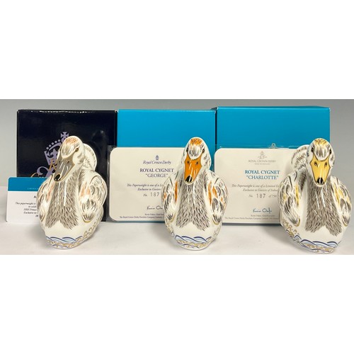 46 - A set of three Royal Crown Derby paperweights, Royal Cygnets, George, Louis and Charlotte, exclusive... 