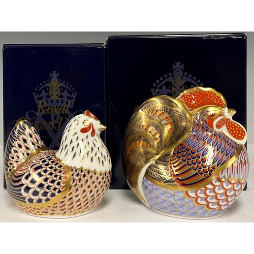 54 - A Royal Crown Derby paperweight, Cockerel, gold stopper, boxed; another, Chicken, gold stopper, boxe... 