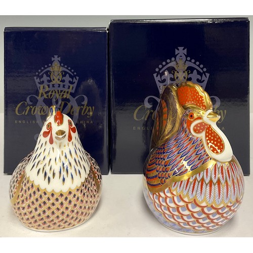 54 - A Royal Crown Derby paperweight, Cockerel, gold stopper, boxed; another, Chicken, gold stopper, boxe... 