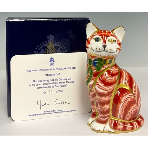 10 - A Royal Crown Derby paperweight, Cheshire Cat, limited edition 34/500, commissioned by John Sinclair... 