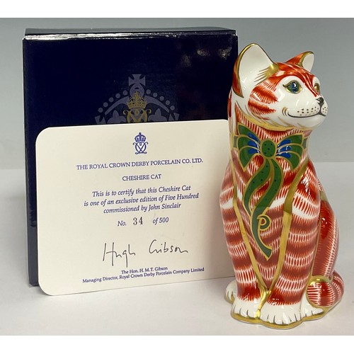 10 - A Royal Crown Derby paperweight, Cheshire Cat, limited edition 34/500, commissioned by John Sinclair... 