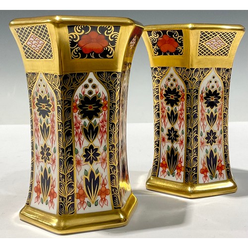 58 - A pair of Royal Crown Derby hexagonal vases, solid gold band, second quality (2)