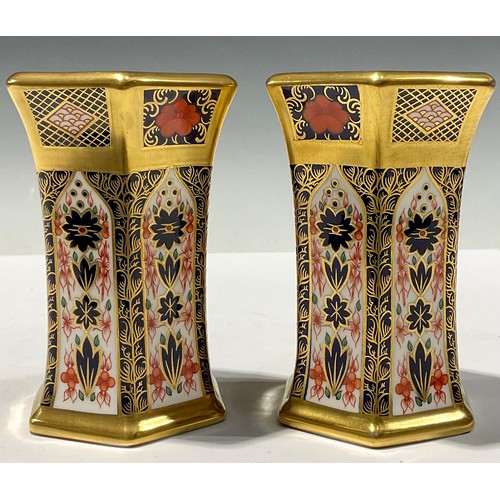 58 - A pair of Royal Crown Derby hexagonal vases, solid gold band, second quality (2)