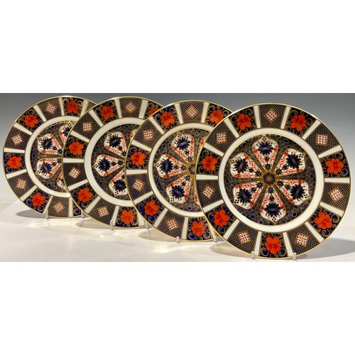 59 - A set of four Royal Crown Derby 1128 Imari pattern dessert plates, 21cm diameter, second quality (4)