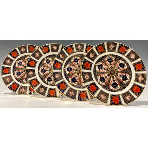 59 - A set of four Royal Crown Derby 1128 Imari pattern dessert plates, 21cm diameter, second quality (4)