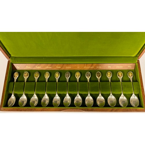 72 - A collection of twelve silver teaspoons, The Royal Horticultural Society Flower Spoons, each oval gi... 