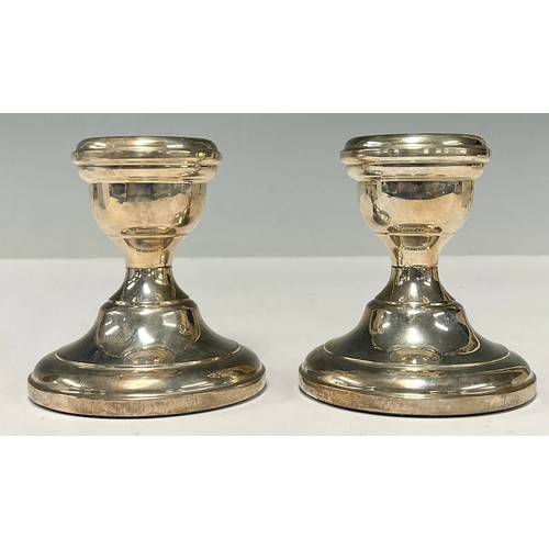 125 - A pair of Elizabeth II silver boudoir candlesticks, Birmingham 1966, boxed