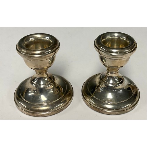 125 - A pair of Elizabeth II silver boudoir candlesticks, Birmingham 1966, boxed