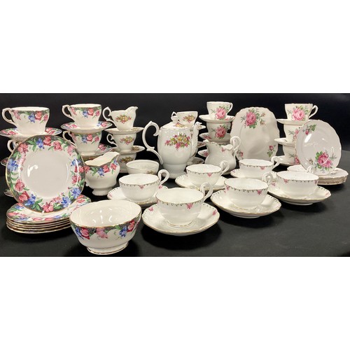 132 - A Paragon tea service for six, decorated with a band of pink and blue flowers, comprising cream jug,... 