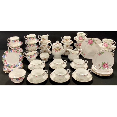 132 - A Paragon tea service for six, decorated with a band of pink and blue flowers, comprising cream jug,... 