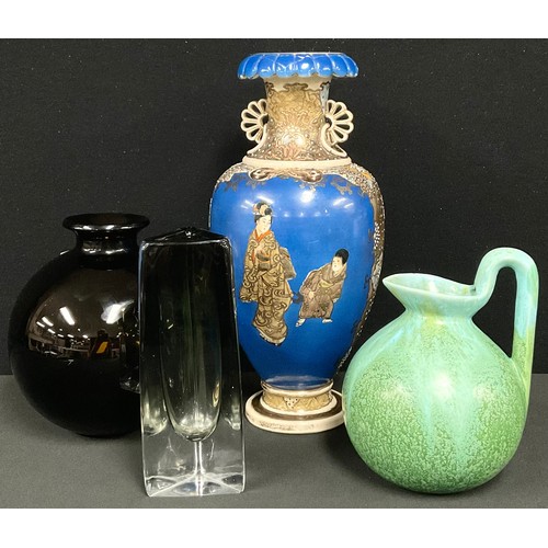 143 - Glass & Ceramics - a Ruskin style studio pottery jug, in mottled tones of green, lofty scroll handle... 