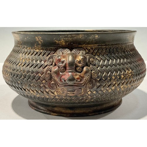 145 - A Chinese bronze censer, lion mask handles, character marks to base, approx. 19cm wide over handles,... 