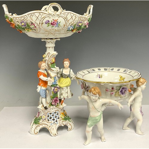 146 - A Dresden porcelain figural table centrepiece, moulded, decorated and applied with a courting couple... 