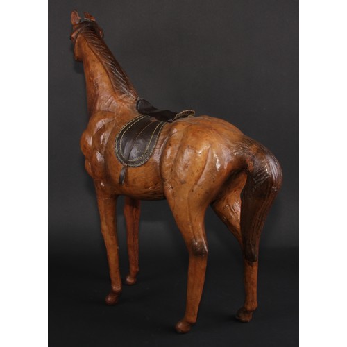 3336 - A mid-20th century leather-wrapped model, of a horse, in the manner of Liberty, 52.5cm high, 48.5cm ... 