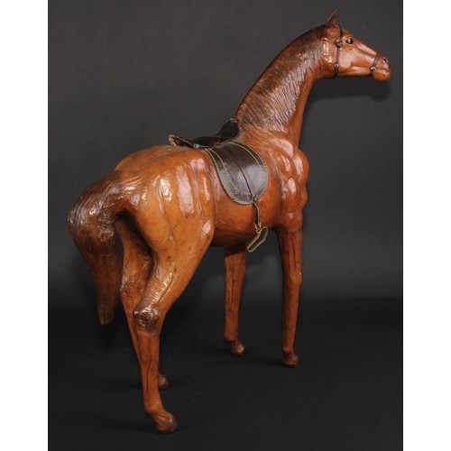 3336 - A mid-20th century leather-wrapped model, of a horse, in the manner of Liberty, 52.5cm high, 48.5cm ... 