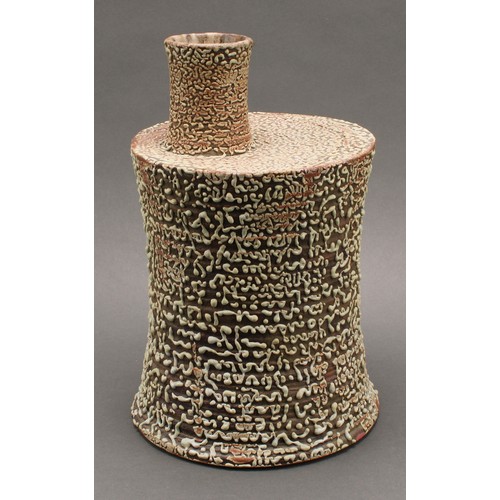 3192 - Studio Pottery - a chimney vase, by Andrew Palin, wriggle worked in green glaze on a brown ground, 3... 