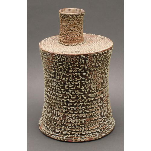 3192 - Studio Pottery - a chimney vase, by Andrew Palin, wriggle worked in green glaze on a brown ground, 3... 