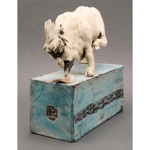 3194 - Studio Pottery - a model of a bull in grotesque mask mauling an infant mask, by Jan Lewis Eccleston,... 