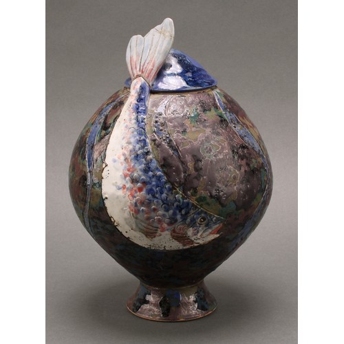 3201 - Studio Pottery - a stoneware pedestal ovoid fish vase and cover, by Roger Cockram, applied in low re... 