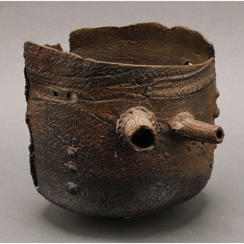 3199 - Studio Pottery - a salt glazed stoneware vase, by Peter Clough, resembling a riveted rusty receptacl... 