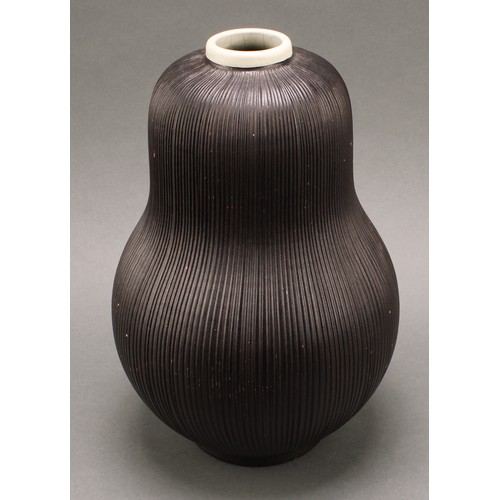 3208 - Studio Pottery - an Ekeby ovoid reeded pear shaped vase, by Sven Erik Skawonius, glazed throughout i... 