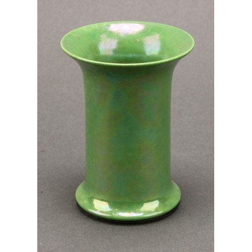 3104 - A Ruskin pottery cylindrical flared vase, in green lustre, spreading circular foot, 7.5cm high, impr... 