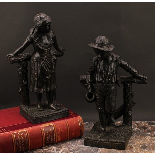 3070 - A pair of Bretby Art Pottery figures, glazed in bronze effect throughout, as a country boy and girl ... 