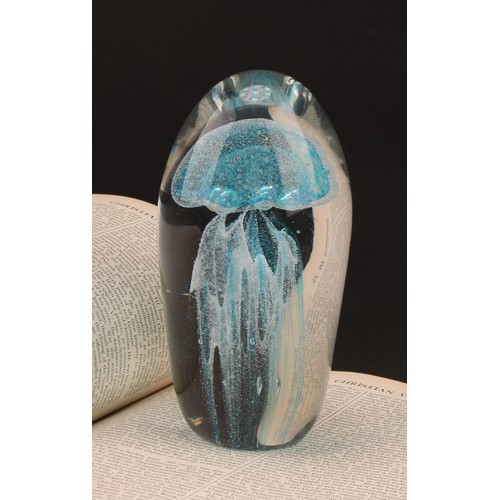 3219 - A large dump shaped blue glass paperweight, with jellyfish inclusion, 16.5cm