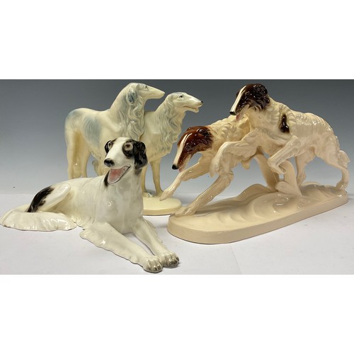 3090 - An Austrian Royal Dux model of a resting Borzoi dog, number 14543, 38cm wide, printed and impressed ... 