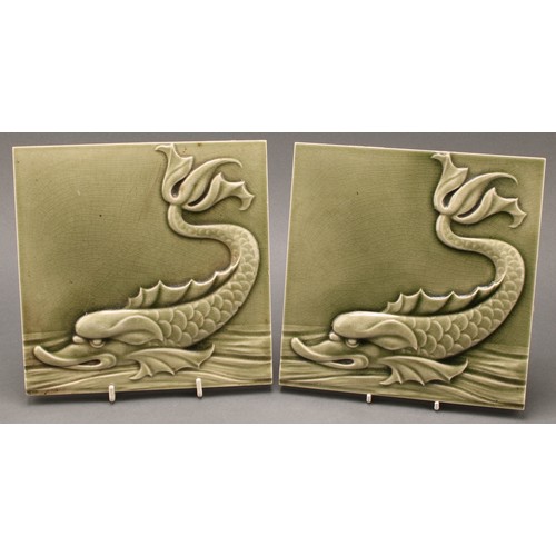 3056 - Wall Tiles - a pair of Maw wall tiles, applied in low relief with sea serpents, celadon glazed, each... 