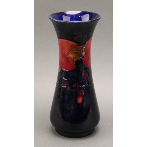 3127 - A Moorcroft Pomegranate pattern slender baluster vase, 26cm, signed in blue