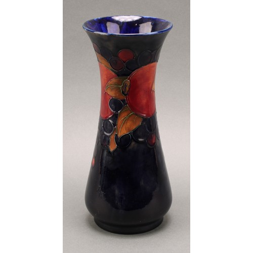 3127 - A Moorcroft Pomegranate pattern slender baluster vase, 26cm, signed in blue