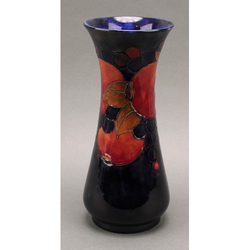 3127 - A Moorcroft Pomegranate pattern slender baluster vase, 26cm, signed in blue