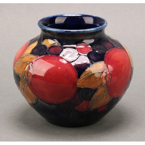 3126 - A Moorcroft Pomegranate pattern baluster vase, 17.5cm; another smaller Pomegranate pattern compresse... 