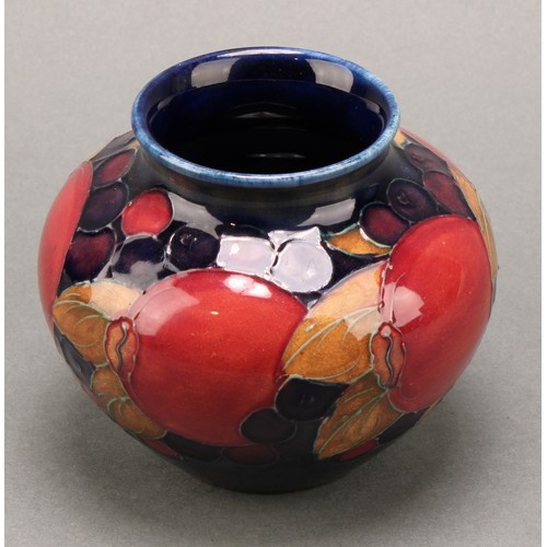 3126 - A Moorcroft Pomegranate pattern baluster vase, 17.5cm; another smaller Pomegranate pattern compresse... 