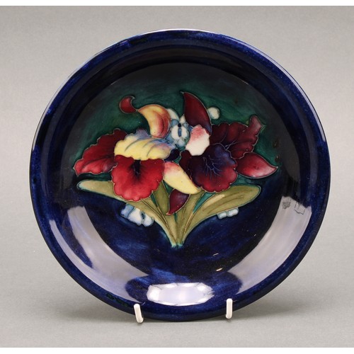 3123 - A Moorcroft Iris pattern plate,18cm diameter; a Moorcroft Anemone pattern trinket dish, 7.5cm diamet... 