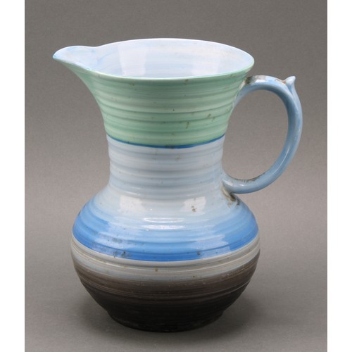 3148 - A Shelley Harmony Art Ware ribbed jug, painted with bands in tones of blue, green and black, 23cm hi... 