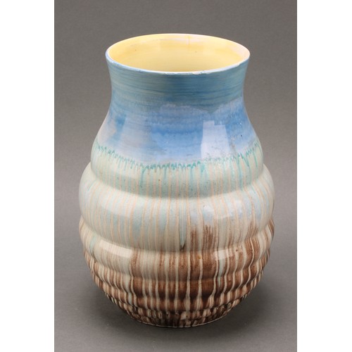 3134 - A pair of Shelley Harmony Art Ware ribbed conical vases, drip glazed in tones of blue, ochre and bro... 