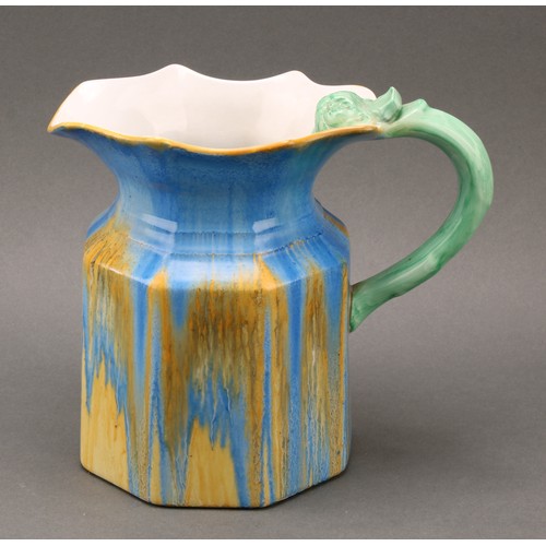 3144 - A Shelley Harmony Art Ware jug, drip glazed in tones of blue, yellow and green, the handle terminati... 