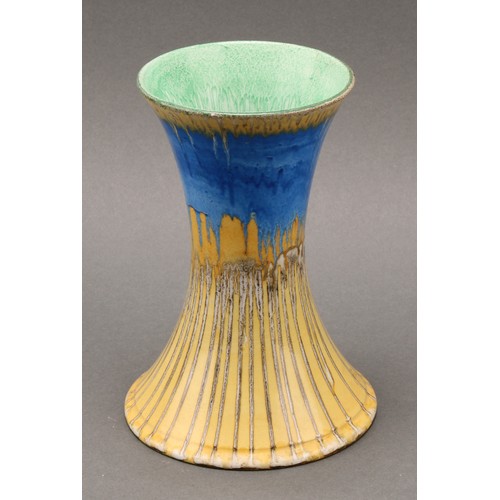 3144 - A Shelley Harmony Art Ware jug, drip glazed in tones of blue, yellow and green, the handle terminati... 