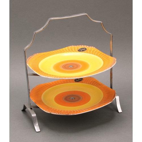 3152 - A Shelley Harmony Art Ware two-tier cake stand, painted with bands in tones of orange and brown, 27c... 