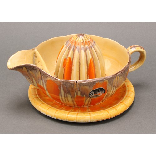 3152 - A Shelley Harmony Art Ware two-tier cake stand, painted with bands in tones of orange and brown, 27c... 